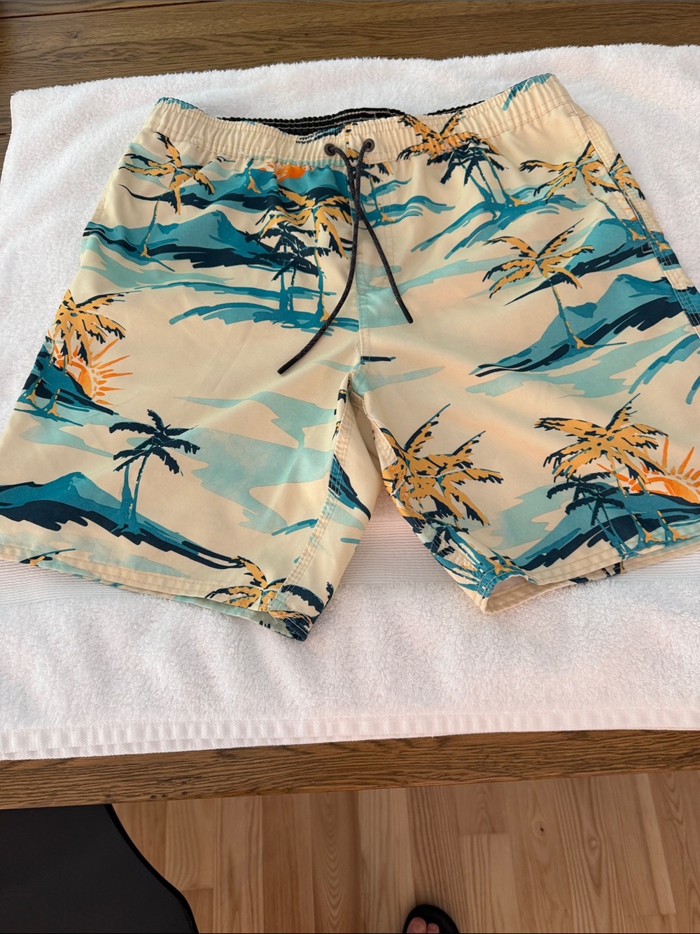 O'Neill Cream Swim Trunks with Teal & Orange Palm Print. No netting inside